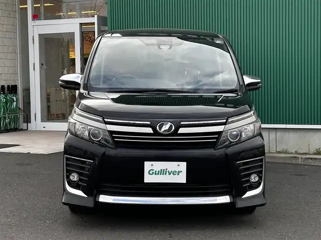トヨタ ヴォクシー ZS 煌Ⅱ 宮城県 2016(平28)年 8.8万km ブラック セーフティセンスC/・プリクラッシュセーフティ/・レーンディパーチャーアラート/・オートマチックハイビーム/先行車発進告知機能/フリップダウンモニター/純正9インチナビ（NSZT-Y64T）/・CD/DVD/・Bluetooth/・フルセグTV/バックカメラ/ビルトインETC/両側パワースライドドア/革巻きステアリング/LEDヘッドランプ/フォグランプ/オートライト/スマートキー＆プッシュスタート/電動格納ミラー/社外15インチAW/純正ドアバイザー/純正フロアマット/Wエアバッグ