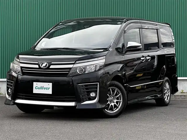 トヨタ ヴォクシー ZS 煌Ⅱ 宮城県 2016(平28)年 8.8万km ブラック セーフティセンスC/・プリクラッシュセーフティ/・レーンディパーチャーアラート/・オートマチックハイビーム/先行車発進告知機能/フリップダウンモニター/純正9インチナビ（NSZT-Y64T）/・CD/DVD/・Bluetooth/・フルセグTV/バックカメラ/ビルトインETC/両側パワースライドドア/革巻きステアリング/LEDヘッドランプ/フォグランプ/オートライト/スマートキー＆プッシュスタート/電動格納ミラー/社外15インチAW/純正ドアバイザー/純正フロアマット/Wエアバッグ