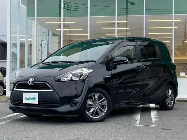 トヨタ シエンタ ハイブリッド G 静岡県 2018(平30)年 5.7万km ブラックマイカ エンジンスタートボタン/ワンオーナー/パワーステアリング/パワーウィンドウ/アイドリングストップ/スマートキー/オートエアコン/ETC2.0/バックカメラ/純正SDナビ（CD.BT.フルセグ）/3列シート/ウォークスルー/純正アルミホイール/純正フロアマット/両側パワースライドドア/ABS/横滑り防止装置/Wエアバック/2列目タンブルシート