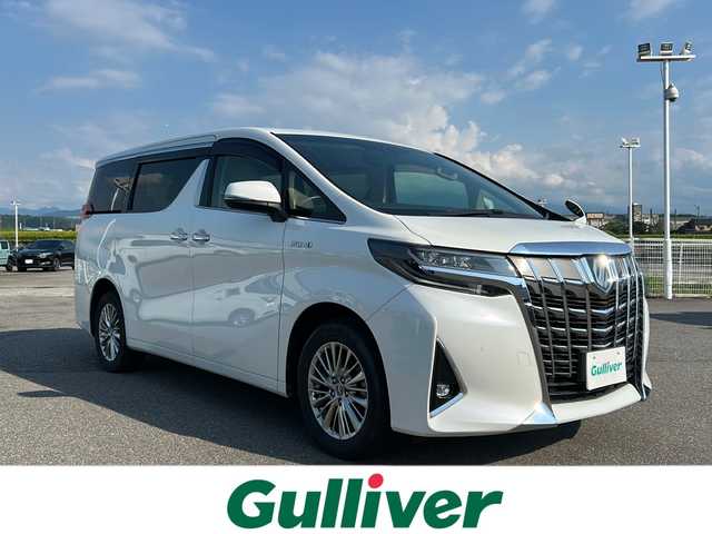 トヨタ アルファードハイブリット X 富山県 2020(令2)年 4.9万km ホワイトパールクリスタルシャイン 禁煙車/４ＷＤ/純正ディスプレイオーディオ/フルセグTV/バックカメラ/BlueTooth・ＣＤ・ＤＶＤ/両側パワースライド/純正フリップダウンモニター/クルーズコントロール/レーンキープアシスト/衝突軽減ブレーキ/コーナーセンサー/１００Ｖ電源/純正アルミホイール/純正フロアマット/オートライト/オートマチックハイビーム/ETC/保証書・記録簿/取扱説明書