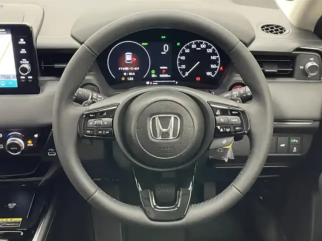 ホンダ ヴェゼル ハイブリッド e:HEV Z 愛知県 2025(令7)年 0.1千km クリスタルブラックパール 登録済未使用車　純正９型ＤＡ　ＢＳＭ　黒ハーフレザー　追従クルコン　フルセグ　ＥＴＣ　パドルシフト　ホンダセンシング　ステアリングヒーター　シートヒーター　衝突軽減　ワイヤレス充電　ＬＥＤライト　禁煙　USB　フォグ　コーナーセンサー　オートハイビーム　プッシュスタート　スマートキー　誤発進抑制　レーンキープ