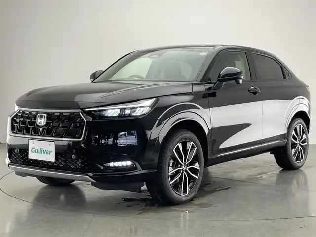 ホンダ ヴェゼル ハイブリッド e:HEV Z 愛知県 2025(令7)年 0.1千km クリスタルブラックパール 登録済未使用車　純正９型ＤＡ　ＢＳＭ　黒ハーフレザー　追従クルコン　フルセグ　ＥＴＣ　パドルシフト　ホンダセンシング　ステアリングヒーター　シートヒーター　衝突軽減　ワイヤレス充電　ＬＥＤライト　禁煙　USB　フォグ　コーナーセンサー　オートハイビーム　プッシュスタート　スマートキー　誤発進抑制　レーンキープ