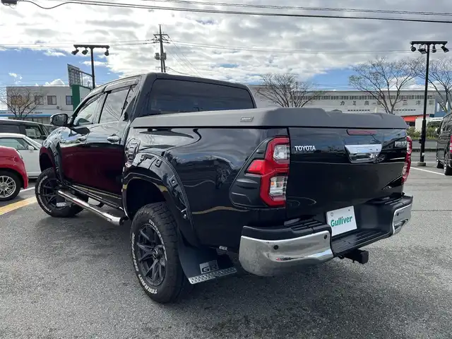 トヨタ ハイラックス Z 鳥取県 2021(令3)年 2.7万km アティチュードブラックマイカ ４WD　ターボ車/社外9型ナビ/フルセグ/DVD/CD/BT/USB/フロント/サイド/バックカメラ/前後ドライブレコ＾ダー・ETC/２インチリフトアップ/フロントバンパーガード/GIギアサイドステップ/SUXONサイドに本出しマフラー/GRハードトノカバー/純正荷台内カバー/TRD　GRマットフラップ/RAYS１７インチアルミホイール/Monstaホワイトレターブロックタイヤ/社外オーバーフェンダー/リヤヒッチメンバー/レザー調シートカバー/社外コンビハンドル・社外シフトノブ/トヨタセーフティセンス/レーダークルーズコントロール/レーンキープアシスト/LEDヘットライト/プッシュエンジンスタート/フロアマット/ドアバイザー/保証書・取扱説明書