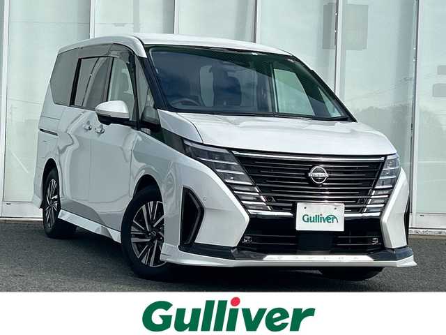日産 セレナ e－パワー ルキシオン 福岡県 2023(令5)年 1.4万km プリズムホワイト ワンオーナー/プロパイロット2.0/純正フリップダウンモニター/純正フロントマスク/純正ナビ/（BT/フルセグ/AM/FM/USB/HDMI/AｐｐleCarPlay)/アラウンドビューモニター/Bカメラ/フロントカメラ/サイドカメラ/両側パワースライドドア/レーダークルーズコントロール/LEDヘッドライト/オートライト/オートマチックハイビーム/合皮シート/シートヒーター/ステアリングヒーター/ステアリングスイッチ/純正16インチAW/デジタルインナーミラー/HUD/電動パーキングブレーキ/置くだけ充電/ePedal/パーキングアシスト/横滑り防止装置/コーナーセンサー/レーンキープアシスト/盗難防止装置/衝突被害軽減システム/ウィンカーミラー/リアサンシェード/スマートキー/ETC2.0/保証書/取扱説明書