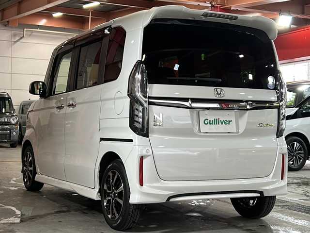 ホンダ Ｎ ＢＯＸ カスタム G L ホンダセンシング 静岡県 2020(令2)年 5.1万km プラチナホワイトパール 【安全装備】/ホンダセンシング/アダプティブ・クルーズ・コントロール（ACC）/・作動車速域：約30km/hから100km/h間/車線維持支援システム（LKAS）/・作動車速：約65km/hから100km/h間/・ステアリング制御/衝突軽減ブレーキ（CMBS）/・歩行者検知機能/・作動車速：約80km/h未満時/・対向車車速：約30km/hから80km/h時/誤発進抑制機能（前進）/・ミリ波レーダー検知：作動車速10km/h未満/歩行者事故低減ステアリング/・作動車速10km/hから40km/h間/路外逸脱抑制機能/・作動車速：約60km/hから100km/h間/先行車発進お知らせ機能/標識認識機能/オートハイビーム/誤発進抑制機能（後進）・ソナー検知：作動車速10km/h未満 /【主要装備】/社外ナビ　/バックカメラ　/ドライブレコーダー　/片側パワースライドドア　/ビルトインＥＴＣ　/チップアップシート　/ステアリングスイッチ　/シートヒーター