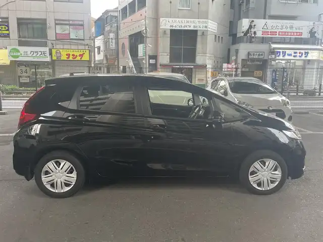ホンダ フィット 13G L ホンダセンシング 大阪府 2018(平30)年 0.5万km クリスタルブラックパール ホンダセンシング/・安全運転支援システム/・アダプティブクルーズコントロール/・衝突軽減ブレーキ/・誤発進抑制機能/・歩行者事故低減ステアリング/・路外逸脱抑制機能/・車線維持支援システム/・先行車発進お知らせ機能/・標識認識機能/ホンダ純正ナビ/・フルセグTV/・Bluetooth/・バックカメラ/LEDヘッドライト/・オートライト/レーンキープアシスト/プッシュスタート/ワンオーナー/新車保証書/取扱説明書