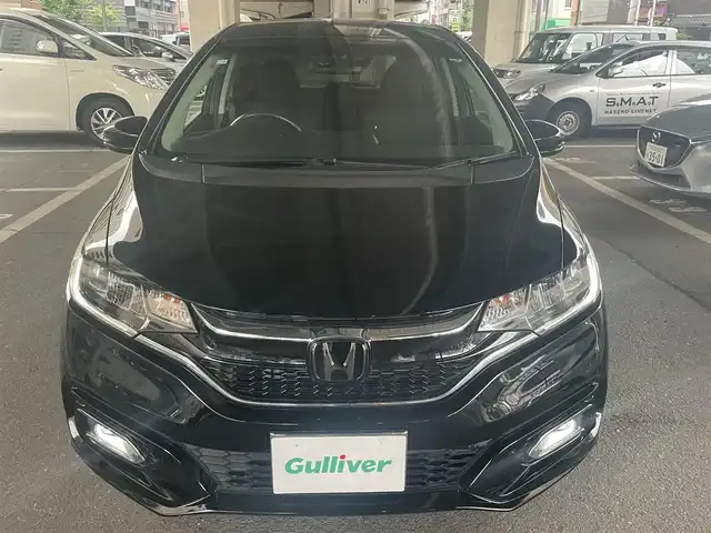 ホンダ フィット 13G L ホンダセンシング 大阪府 2018(平30)年 0.5万km クリスタルブラックパール ホンダセンシング/・安全運転支援システム/・アダプティブクルーズコントロール/・衝突軽減ブレーキ/・誤発進抑制機能/・歩行者事故低減ステアリング/・路外逸脱抑制機能/・車線維持支援システム/・先行車発進お知らせ機能/・標識認識機能/ホンダ純正ナビ/・フルセグTV/・Bluetooth/・バックカメラ/LEDヘッドライト/・オートライト/レーンキープアシスト/プッシュスタート/ワンオーナー/新車保証書/取扱説明書