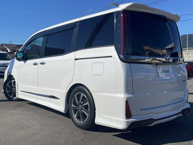 トヨタ ノア Si ダブルバイビーⅡ 山口県 2020(令2)年 4.9万km ホワイトパールクリスタルシャイン 純正９型ナビ（FM/AM/フルセグTV/Bluetooth）/モデリスタフルエアロ/バックカメラ/両側パワースライドドア/ハーフレザーシート/ETC/トヨタセーフティーセンスC/・衝突回避支援型プリクラッシュセーフティ (PCS)/・ レーンディパーチャーアラート (LDA)/・オートマチックハイビーム (AHB)/追従型クルーズコントロール/アイドリングストップ/純正フロアマット/コーナーセンサー/LEDヘッドライト/純正16インチアルミホイール/Wエアバック