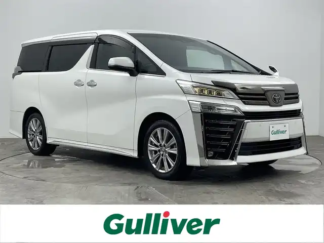 トヨタ ヴェルファイア Z ゴールデンアイズ 大分県 2020(令2)年 3.6万km ホワイトパールクリスタルシャイン TOYOTAセーフティセンス/・プリクラッシュセーフティ/・レーントレーシングアシスト/・レーダークルーズコントロール/・ロードサインアシスト/・アダプティブハイビームアシスト/純正ディスプレイオーディオ/・ナビ機能有り、フルセグTV、USB/・CD/DVDデッキ、BT対応/・AppleCarPlay、AndroidAuto/TVキャンセラー（スイッチタイプ）/ステアリングスイッチ/バックカメラ/12.1型フリップダウンモニター/純正ドライブレコーダー/ビルトインETC2.0/両側電動スライドドア/パワーバックドア/電動パーキング/オートホールド機能/AC100V/100W/横滑り防止装置/電動格納ミラー/純正フロアマット/オートライト/3眼LEDヘッドライト/LEDフォグ/クリアランスソナー /純正18インチアルミホイール/保証書、取説、スペアキー有り
