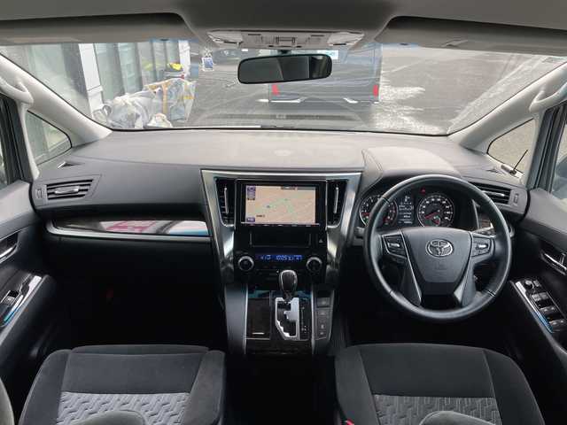 トヨタ アルファード SA 道央・札幌 2015(平27)年 2万km ホワイトパールクリスタルシャイン ４WD/寒冷地仕様/ローダウン/純正ディーラーOPナビ/CD/DVD/BT/フルセグ/純正フリップダウンモニター/横滑り防止装置/クルーズコントロール/クリアランスソナー/バックカメラ/ビルトインETC/ECOMODE/nanoe/ワイパーデアイサー/両側パワースライドドア/N席/２列目オットマン/革巻きステアリング/ステアリングリモコン/電動パーキング/ブレーキホールド/MTモード付AT/プッシュスタート/スマートキー/LEDヘッドライト/オートライト/フォグランプ/電動格納ミラー/ウィンカーミラー/純正フロアマット/ドアバイザー/社外エンジンスターター