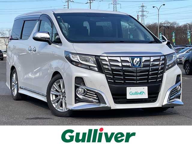 トヨタ アルファード SA 道央・札幌 2015(平27)年 2万km ホワイトパールクリスタルシャイン ４WD/寒冷地仕様/ローダウン/純正ディーラーOPナビ/CD/DVD/BT/フルセグ/純正フリップダウンモニター/横滑り防止装置/クルーズコントロール/クリアランスソナー/バックカメラ/ビルトインETC/ECOMODE/nanoe/ワイパーデアイサー/両側パワースライドドア/N席/２列目オットマン/革巻きステアリング/ステアリングリモコン/電動パーキング/ブレーキホールド/MTモード付AT/プッシュスタート/スマートキー/LEDヘッドライト/オートライト/フォグランプ/電動格納ミラー/ウィンカーミラー/純正フロアマット/ドアバイザー/社外エンジンスターター