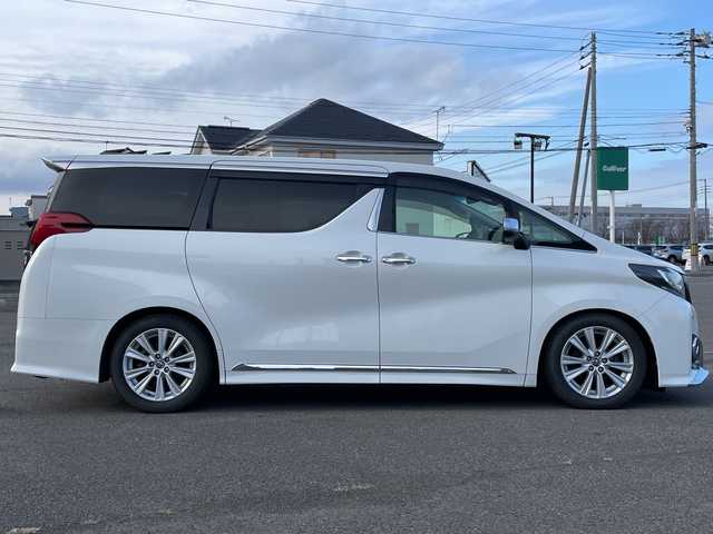 トヨタ アルファード SA 道央・札幌 2015(平27)年 2万km ホワイトパールクリスタルシャイン ４WD/寒冷地仕様/ローダウン/純正ディーラーOPナビ/CD/DVD/BT/フルセグ/純正フリップダウンモニター/横滑り防止装置/クルーズコントロール/クリアランスソナー/バックカメラ/ビルトインETC/ECOMODE/nanoe/ワイパーデアイサー/両側パワースライドドア/N席/２列目オットマン/革巻きステアリング/ステアリングリモコン/電動パーキング/ブレーキホールド/MTモード付AT/プッシュスタート/スマートキー/LEDヘッドライト/オートライト/フォグランプ/電動格納ミラー/ウィンカーミラー/純正フロアマット/ドアバイザー/社外エンジンスターター