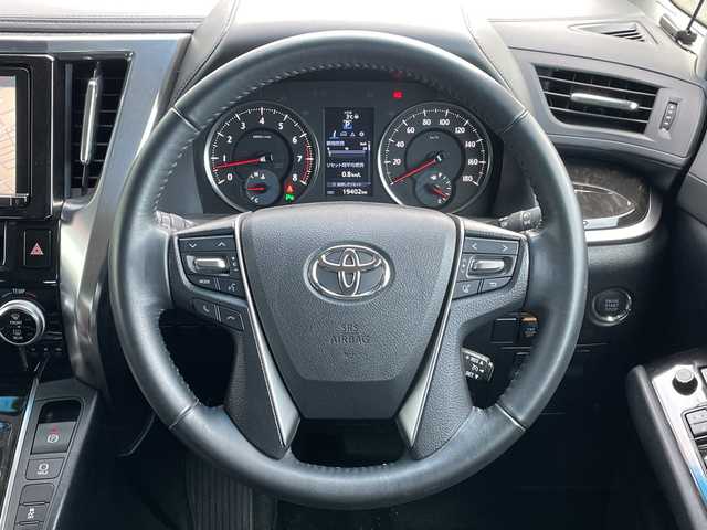 トヨタ アルファード SA 道央・札幌 2015(平27)年 2万km ホワイトパールクリスタルシャイン ４WD/寒冷地仕様/ローダウン/純正ディーラーOPナビ/CD/DVD/BT/フルセグ/純正フリップダウンモニター/横滑り防止装置/クルーズコントロール/クリアランスソナー/バックカメラ/ビルトインETC/ECOMODE/nanoe/ワイパーデアイサー/両側パワースライドドア/N席/２列目オットマン/革巻きステアリング/ステアリングリモコン/電動パーキング/ブレーキホールド/MTモード付AT/プッシュスタート/スマートキー/LEDヘッドライト/オートライト/フォグランプ/電動格納ミラー/ウィンカーミラー/純正フロアマット/ドアバイザー/社外エンジンスターター