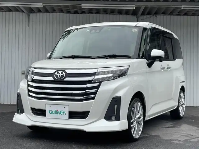 トヨタ ルーミー カスタムG 神奈川県 2021(令3)年 2.3万km パールホワイトⅢ スマートアシスト/両側パワースライドドア/12型フリップダウンモニター/純正メモリナビ(型式：NSZT-W68T)/・CD/DVD/Bluetooth/フルセグテレビ/全方位カメラ/ビルトインETC/ドライブレコーダー/レーダークルーズコントロール/社外17インチAW/前後コーナーセンサー/LEDヘッドライト/プッシュスタート/スマートキー/スペアキー1本/純正フロアマット/取扱説明書/保証書