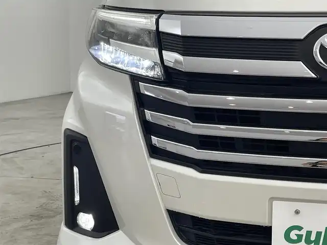 トヨタ ルーミー カスタムG 福岡県 2021(令3)年 2.3万km パールホワイトⅢ 後席モニター　/純正ナビ（ＢＴ，フルセグＴＶ）　/全方位カメラ　/ビルトインＥＴＣ　/前方ドライブレコーダー　/ＡＣＣ　/コーナーセンサー　/衝突軽減ブレーキ　/レーンキープ　/両側電動スライドドア/純正１７インチＡＷ