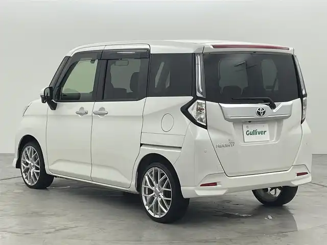トヨタ ルーミー カスタムG 福岡県 2021(令3)年 2.3万km パールホワイトⅢ 後席モニター　/純正ナビ（ＢＴ，フルセグＴＶ）　/全方位カメラ　/ビルトインＥＴＣ　/前方ドライブレコーダー　/ＡＣＣ　/コーナーセンサー　/衝突軽減ブレーキ　/レーンキープ　/両側電動スライドドア/純正１７インチＡＷ