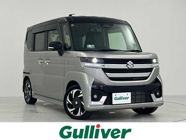スズキ スペーシア カスタム HYBRID XS 大阪府 2023(令5)年 0.9万km スチールシルバーメタリック/ブルーイッシュブラックパール 純正9型ナビ/（CD/DVD/フルセグTV/BT/AppleCarplay/AndroidAuto/FM/AM）/スズキセーフティサポート/・デュアルセンサーブレーキサポート（衝突被害軽減ブレーキ）/・誤発進抑制機能（前方・後方）/・後退時ブレーキサポート/・車線逸脱警報機能/・ふらつき警報機能/・先行車発進お知らせ機能/・ハイビームアシスト（自動でハイ／ロー切替）/・標識認識機能（速度制限・一時停止など）/・全方位モニター用カメラ/ビルトインETC/アダプティブクルーズコントロール/リアパーキングセンサー/両側パワースライドドア/前席シートヒーター/ステアリングヒーター/ステアリングスイッチ/電動パーキングブレーキ/純正フロアマット/LEDヘッドライト/純正15インチAW