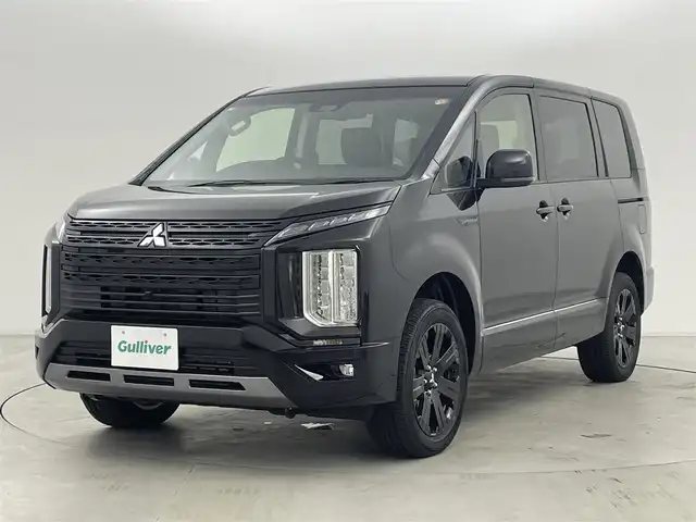 三菱 デリカＤ：５ シャモニー 群馬県 2025(令7)年 0.1千km 黒Ⅱ 登録済未使用車(登録時走行距離：8km)/オリジナルナビ取付パッケージ＋リアモニター取付パッケージ/ALPINED:5専用11型ナビゲーション/ALPINE12.8型後席用モニター/＝＝＝＝＝/e-Assist(運転支援機能)/・衝突被害軽減ブレーキ(FCM)/・車線逸脱警報システム(LDW)/・レーダークルーズコントロール(ACC)/・オートマチックハイビーム(AHB)/・後側方車両検知警報システム(レーンチェンジアシスト機能付)/・誤発進抑制機能(前進時)/・後退時交差車両検知警報(RCTA)/両側パワースライドドア/エレクトリックテールゲート/ハーフレザーシート/前席シートヒーター/ステアリングヒーター/革巻きステアリング/ステアリングスイッチ/アイドリングストップ/電動パーキングブレーキ/オートブレーキホールド/プッシュスタート/スマートキー×2本/取扱説明書/保証書