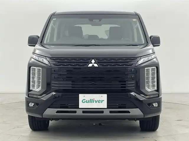 三菱 デリカＤ：５ シャモニー 群馬県 2025(令7)年 0.1千km 黒Ⅱ 登録済未使用車(登録時走行距離：8km)/オリジナルナビ取付パッケージ＋リアモニター取付パッケージ/ALPINED:5専用11型ナビゲーション/ALPINE12.8型後席用モニター/＝＝＝＝＝/e-Assist(運転支援機能)/・衝突被害軽減ブレーキ(FCM)/・車線逸脱警報システム(LDW)/・レーダークルーズコントロール(ACC)/・オートマチックハイビーム(AHB)/・後側方車両検知警報システム(レーンチェンジアシスト機能付)/・誤発進抑制機能(前進時)/・後退時交差車両検知警報(RCTA)/両側パワースライドドア/エレクトリックテールゲート/ハーフレザーシート/前席シートヒーター/ステアリングヒーター/革巻きステアリング/ステアリングスイッチ/アイドリングストップ/電動パーキングブレーキ/オートブレーキホールド/プッシュスタート/スマートキー×2本/取扱説明書/保証書