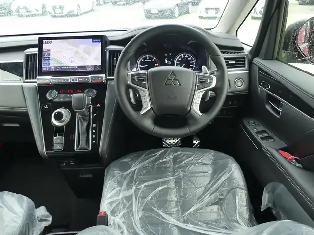 三菱 デリカＤ：５ シャモニー 千葉県 2025(令7)年 0.1千km 黒Ⅱ 登録済未使用車(登録時走行距離：8km)/オリジナルナビ取付パッケージ＋リアモニター取付パッケージ/ALPINED:5専用11型ナビゲーション/ALPINE12.8型後席用モニター/＝＝＝＝＝/e-Assist(運転支援機能)/・衝突被害軽減ブレーキ(FCM)/・車線逸脱警報システム(LDW)/・レーダークルーズコントロール(ACC)/・オートマチックハイビーム(AHB)/・後側方車両検知警報システム(レーンチェンジアシスト機能付)/・誤発進抑制機能(前進時)/・後退時交差車両検知警報(RCTA)/両側パワースライドドア/エレクトリックテールゲート/ハーフレザーシート/前席シートヒーター/ステアリングヒーター/革巻きステアリング/ステアリングスイッチ/アイドリングストップ/電動パーキングブレーキ/オートブレーキホールド/プッシュスタート/スマートキー×2本/取扱説明書/保証書