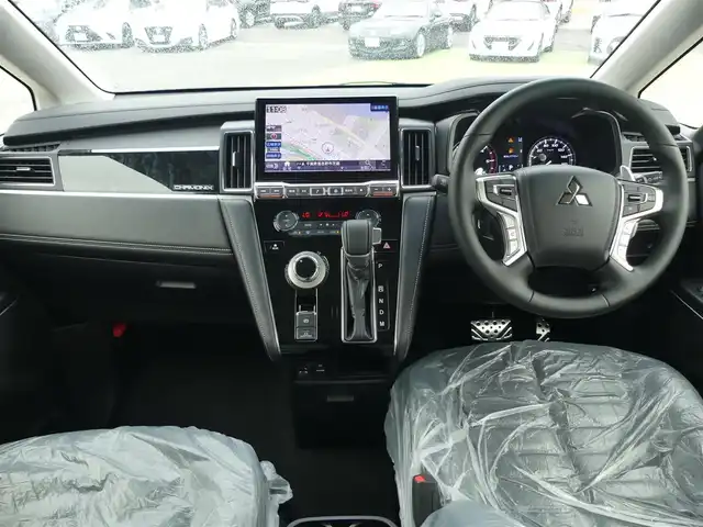 三菱 デリカＤ：５ シャモニー 千葉県 2025(令7)年 0.1千km 黒Ⅱ 登録済未使用車(登録時走行距離：8km)/オリジナルナビ取付パッケージ＋リアモニター取付パッケージ/ALPINED:5専用11型ナビゲーション/ALPINE12.8型後席用モニター/＝＝＝＝＝/e-Assist(運転支援機能)/・衝突被害軽減ブレーキ(FCM)/・車線逸脱警報システム(LDW)/・レーダークルーズコントロール(ACC)/・オートマチックハイビーム(AHB)/・後側方車両検知警報システム(レーンチェンジアシスト機能付)/・誤発進抑制機能(前進時)/・後退時交差車両検知警報(RCTA)/両側パワースライドドア/エレクトリックテールゲート/ハーフレザーシート/前席シートヒーター/ステアリングヒーター/革巻きステアリング/ステアリングスイッチ/アイドリングストップ/電動パーキングブレーキ/オートブレーキホールド/プッシュスタート/スマートキー×2本/取扱説明書/保証書