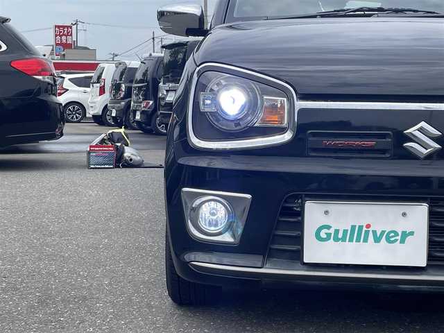 スズキ アルト ワークス 青森県 2017(平29)年 6.2万km ブルーイッシュブラックパール3 ４WD/社外ナビ/フルセグTV/CD/DVD/BT/バックカメラ/柿本改マフラー/ブースト計/スマートキー×２/横滑り防止装置/プッシュスタート/シートカバー付き/社外エアクリーナー/純正マフラー、エアクリーナー、ホーン積込