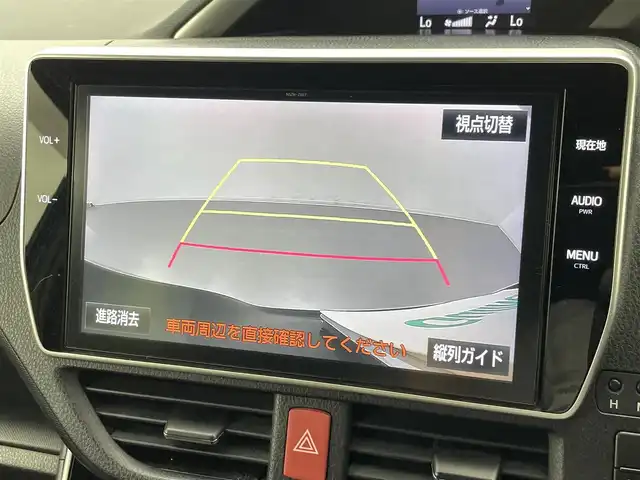 トヨタ ヴォクシー ZS 煌 熊本県 2018(平30)年 7万km ブラッキッシュアゲハガラスフレーク 純正10インチナビ（ＣＤ・ＤＶＤ・フルセグ・ＢＴ・ＳＤ・HDMI）/純正フリップダウンモニター/バックカメラ　/社外前後ドライブレコーダー　/ビルトインＥＴＣ　/両側パワースライドドア　/トヨタセーフティーセンス/・プリクラッシュセーフティ/・先行車発進お知らせ機能/・レーンキープアシスト/・クルーズコントロール/・レーンディパーチャーアラート/・オートマチックハイビーム/横滑り防止/アイドリングストップ/純正フロアマット/純正１６インチAW/オートライト/LEDヘッドライト/フォグライト/スマートキー/プッシュスタート