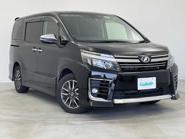 トヨタ ヴォクシー ZS 煌Ⅱ 新潟県 2016(平28)年 6.6万km ブラック 純正ディーラーＯＰナビ/フリップダウンモニター/プリクラッシュセーフティ/車線逸脱警報システム/ＥＴＣ/前後ドライブレコーダー/両側パワースライドドア/オートライト/オートハイビーム/ＬＥＤヘッドライト/フォグランプ/アイドリングストップ/プッシュスタート/純正16インチアルミホイール/フロアマット