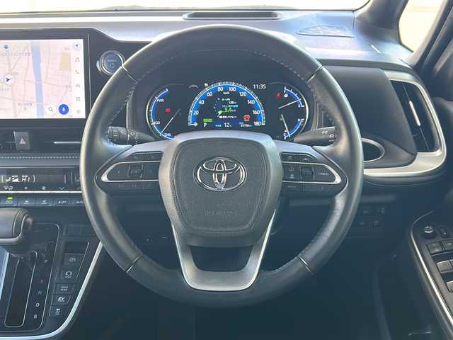 トヨタ ヴォクシー ハイブリッド S－Z 東京都 2022(令4)年 6.6万km ホワイトパールクリスタルシャイン ワンオーナー/コネクティッドナビ対応8インチディスプレイオーディオ/・DTV/BT/USB/AｐｐぇCarPlay/AndroidAuto/ラジオ/セーフティーセンス/・プリクラッシュセーフティー/・レーントレーシングアシスト/・レーンディパーチャーアラート/・レーダークルーズコントロール/・オートマチックハイビーム/・ロードサインアシスト/・ドライバー異常時対応システム/・プロアクティブドライビングアシスト/・発進遅れ告知機能/パーキングサポートブレーキ（前後方静止物）/ボディ同色ドアミラー（電動オート格納機能/ウインカー付）/ビルトインETC2.0/シートヒーター（運転席/助手席）/AC100V1200Wコンセント/取扱説明書/新車時保証書