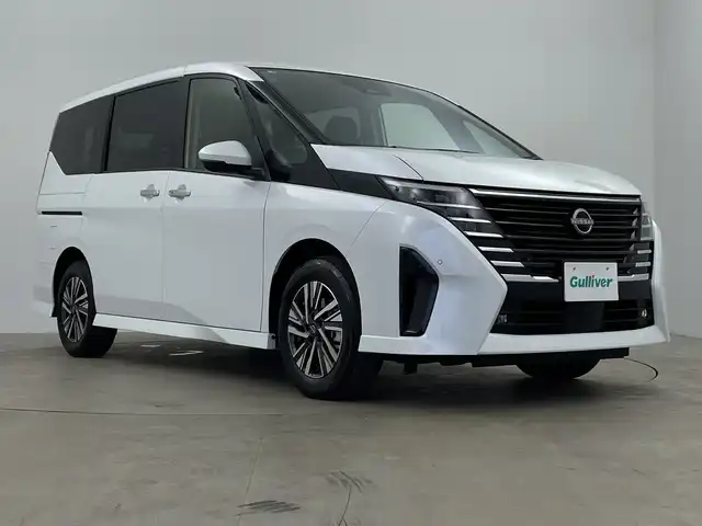 日産 セレナ e－パワー ハイウェイスター V 鹿児島県 2025(令7)年 0.1千km プリズムホワイト e-POWER　/置くだけ充電/両側電動スライドドア/フルセグ/BT/カープレイ/アンドロイドオート/純正フリップダウンモニター/ヘッドランプオートレベライザー+/アダプティブLEDヘッドライトシステム/インテリジェント アラウンドビューモニター/インテリジェント ルームミラー/アドバンスドドライブアシストディスプレイ（12.3インチカラーディスプレイ）/統合型インターフェースディスプレイ/ワイヤレス充電器+6スピーカー/NissanConnectナビゲーションシステム/（地デジ内蔵）車載通信ユニット/ETC2.0ユニット（ビルトインタイプ）/ドライブレコーダー（前後セット）/プロパイロット（ナビリンク機能付）/プロパイロット緊急停止支援システム付/SOSコール（488後席専用モニターHDMI NissanConnectナビ付車用(