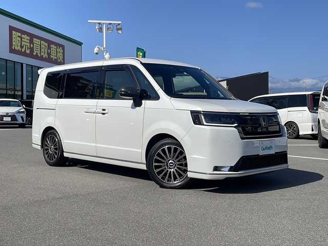 ホンダ ステップワゴン スパーダ 長野県 2023(令5)年 1.9万km プラチナホワイトパール ワンオーナー/禁煙車/純正11インチナビ LXM-237VFLi/バックカメラ/クルーズコントロール　追従走行あり/両側パワースライドドア/ハーフレザー/前席シートヒーター/アイドリングストップ/ドライブレコーダー/デジタルインナーミラー/コーナーセンサー/衝突被害軽減システム/レーンキープアシスト/横滑り防止装置/USB入力端子/ETC/AW　MUGEN/フロアマット MUGEN/フロントグリル　MUGEN/スマートキー