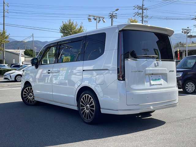 ホンダ ステップワゴン スパーダ 長野県 2023(令5)年 1.9万km プラチナホワイトパール ワンオーナー/禁煙車/純正11インチナビ LXM-237VFLi/バックカメラ/クルーズコントロール　追従走行あり/両側パワースライドドア/ハーフレザー/前席シートヒーター/アイドリングストップ/ドライブレコーダー/デジタルインナーミラー/コーナーセンサー/衝突被害軽減システム/レーンキープアシスト/横滑り防止装置/USB入力端子/ETC/AW　MUGEN/フロアマット MUGEN/フロントグリル　MUGEN/スマートキー