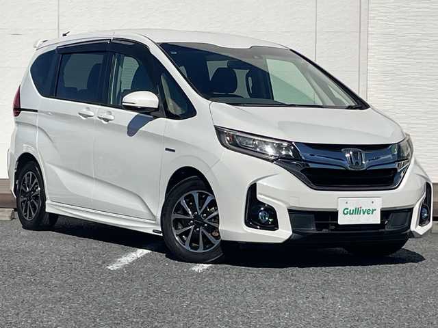 ホンダ フリード ハイブリット G ホンダセンシング 千葉県 2017(平29)年 5.7万km ホワイトオーキッドパール モデューロエアロ　モデューロアルミ　９型ナビＶＸＭ－１７５ＶＦＮｉ　フリップダウンモニター　バックカメラ　両側電動スライドドア　ＢＴ　ドラレコ　ETC　レーダークルーズ　LEDライト　オートライト