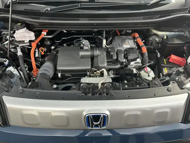 ホンダ フリード ハイブリット e:HEV クロスター 栃木県 2024(令6)年 0.9万km フレスコブルーパール 純正ナビ/（フルセグTV/BT/FM・AM/Apple carplay)/バックカメラ/ホンダセンシング/・衝突被害軽減システム/・レーンキープアシスト/・誤発進抑制装置/・クルーズコントロール/・ブラインドストップモニター/ドライブレコーダー/横滑り防止装置/両側パワースライドドア/電動格納ミラー/前席シートヒーター/ステアリングリモコン/革巻きステアリング/純正１５インチAW/ドアバイザー