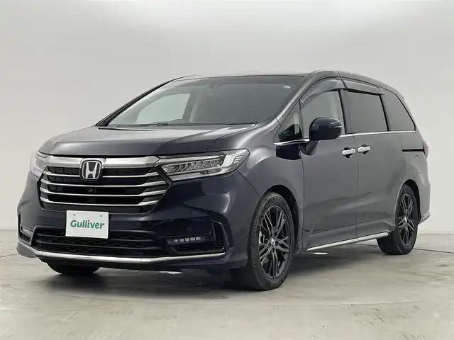 ホンダ オデッセイ ハイブリッド e:HEVアブソルート EX 群馬県 2021(令3)年 4.4万km プレミアムヴィーナスブラックP 純正フリップダウンモニター/純正10インチSDナビ/（フルセグTV/BT/CD/DVD/SD/HDMI）/ナビ装着用スペシャルパッケージ＋ETC2.0車載器/マルチビューカメラシステム/Hondaスマートパーキングアシスト/ブラインドスポットインフォメーション/ハンズフリーアクセスパワーテールゲート/前席シートヒーター/前席パワーシート＋運転席大型アームレスト/AC電源1500W/2列目プレミアムクレードルシート/ホンダセンシング/・衝突軽減ブレーキ（CMBS）/・前後方誤発進抑制機能/・路外逸脱抑制機能/・アダプティブクルーズコントロール/・車線維持支援システム/・先行車発進お知らせ/・機能標識認識機能