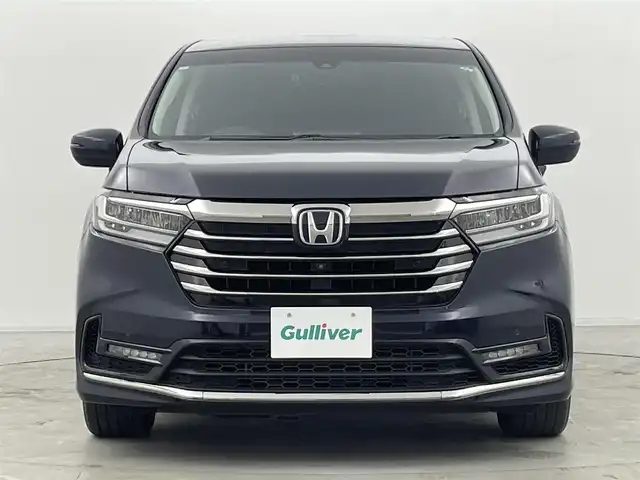 ホンダ オデッセイ ハイブリッド e:HEVアブソルート EX 群馬県 2021(令3)年 4.4万km プレミアムヴィーナスブラックP 純正フリップダウンモニター/純正10インチSDナビ/（フルセグTV/BT/CD/DVD/SD/HDMI）/ナビ装着用スペシャルパッケージ＋ETC2.0車載器/マルチビューカメラシステム/Hondaスマートパーキングアシスト/ブラインドスポットインフォメーション/ハンズフリーアクセスパワーテールゲート/前席シートヒーター/前席パワーシート＋運転席大型アームレスト/AC電源1500W/2列目プレミアムクレードルシート/ホンダセンシング/・衝突軽減ブレーキ（CMBS）/・前後方誤発進抑制機能/・路外逸脱抑制機能/・アダプティブクルーズコントロール/・車線維持支援システム/・先行車発進お知らせ/・機能標識認識機能