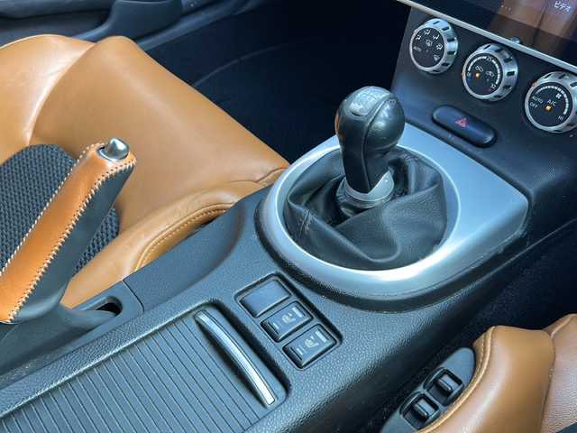 日産 フェアレディ Ｚ ロードスター バージョンST 兵庫県 2005(平17)年 7.7万km 黒 純正メーカーナビ/ドライブレコーダー/シートヒーター/社外エアロ（フロント，サイド，リア）/社外20インチアルミ【VENERDi】/ETC/ハーフレザーシート/社外ディスプレイオーディオ/パワーシート/社外マフラー/クスコタワーバー(フロント)/社外足回り(クスコ)