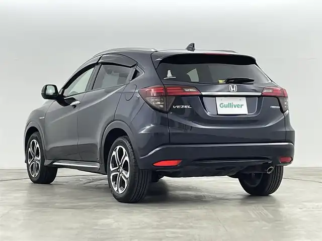 ホンダ ヴェゼル ハイブリッド Z ホンダセンシング 福島県 2018(平30)年 3.3万km ミッドナイトブルービームM ホンダセンシング/・衝突軽減ブレーキ /・誤発進抑制機能 /・歩行者事故低減ステアリング /・路外逸脱抑制機能 /・アダプティブ・クルーズ・コントロール/・車線維持支援システム/・先行車発進お知らせ機能 /・標識認識機能/純正ナビゲーション/・型式：VXM-197VFEi/・Bluetooth/TV/CD/DVD/AM・FM/・バックカメラ/・ETC/プッシュスタート/・スマートキー/・電子パーキング/・オートホールド/LEDライト/・オートライト/・フォグライト/革巻きステアリング/・ステアリングスイッチ/・パドルシフト/電動格納ウィンカーミラー/純正フロアマット/ドアバイザー