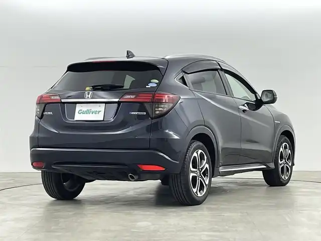 ホンダ ヴェゼル ハイブリッド Z ホンダセンシング 福島県 2018(平30)年 3.3万km ミッドナイトブルービームM ホンダセンシング/・衝突軽減ブレーキ /・誤発進抑制機能 /・歩行者事故低減ステアリング /・路外逸脱抑制機能 /・アダプティブ・クルーズ・コントロール/・車線維持支援システム/・先行車発進お知らせ機能 /・標識認識機能/純正ナビゲーション/・型式：VXM-197VFEi/・Bluetooth/TV/CD/DVD/AM・FM/・バックカメラ/・ETC/プッシュスタート/・スマートキー/・電子パーキング/・オートホールド/LEDライト/・オートライト/・フォグライト/革巻きステアリング/・ステアリングスイッチ/・パドルシフト/電動格納ウィンカーミラー/純正フロアマット/ドアバイザー