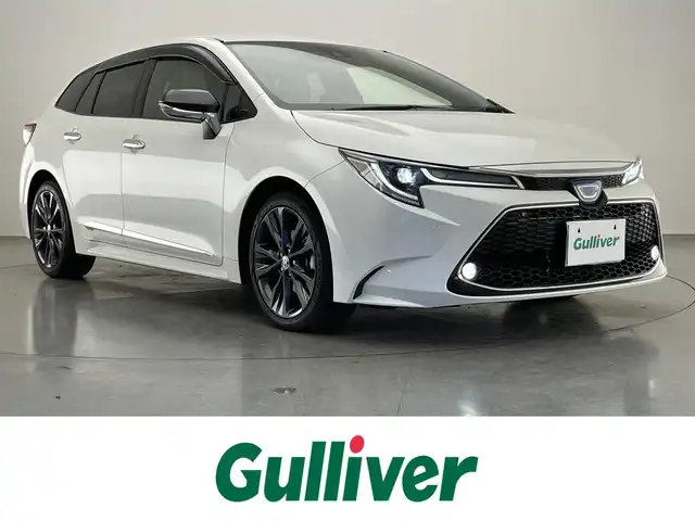トヨタ カローラツーリング ハイブリッド ダブルバイビー 愛知県 2020(令2)年 5.8万km ホワイトパールクリスタルシャイン 純正９型ＤＡナビフルセグＴＶ　シートヒーター　ＤＶＤデッキ　革調シートカバー　モデリスタガーニッシュ多数　電動パーキング　ＨＵＤ　前後ドラレコ　セーフティセンス　衝突軽減　追従クルコン　ＬＥＤライト　禁煙車　純正フロアマット　ドアバイザー　コーナーセンサー　ステアリングヒーター　トノカバー
