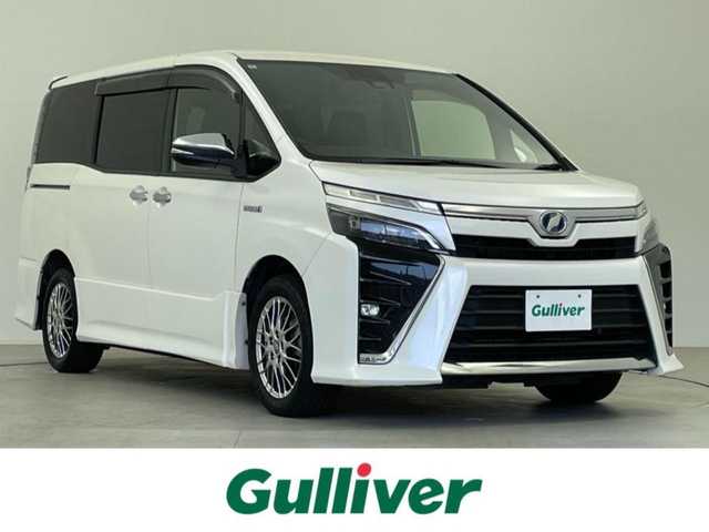 トヨタ ヴォクシー ハイブリッド ZS 煌 千葉県 2018(平30)年 8万km ホワイトパールクリスタルシャイン 純正９型ナビ　/・NSZT-Y66T/・CD/DVD/Bluetooth/AM/FM/・バックカメラ/・フリップダウンモニター/トヨタセフティーセンス/・衝突被害軽減ブレーキ/・アダプティブクルーズコントロール/・先行車発進警報/・レーンキープアシスト/両側パワースライドドア/シートヒーター/ステアリングリモコン/電格ミラー/ETC/スマートキー/取説・保証書