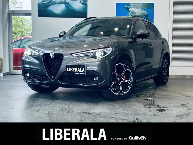 アルファロメオ ステルヴィオ 2.2ターボ ディーゼルQ4 ヴェローチェ 大阪府 2021(令3)年 1.5万km グレー ハーマンカードン/赤革/パワーシート/シートヒーター/Dシートメモリ/ステアリングヒーター/純正ナビ/TV/バックカメラ/ACC/ブラインドスポット/電動リアゲート/純正20インチAW/ワイヤレス充電/パドルシフト