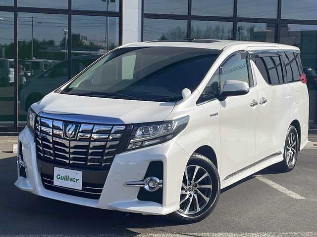 トヨタ アルファードハイブリット SR Cパッケージ 道東・釧路十勝 2015(平27)年 10.8万km ホワイトパールクリスタルシャイン ・サンルーフ/・4WD/・純正9インチSDナビ/(BT フルセグ CD DVD FM AM)/・バックカメラ/・純正11インチフリップダウンモニター/・レーダークルーズコントロール/・両側パワースライドドア/・電動リアゲート/・AC１００V（１５００W）/・前席・2ndパワーシート/・革シート/・電動オットマン/・前席シートヒーター/・ETC2.0/・衝突軽減システム/・横滑り防止/・コーナーセンサー/・前方ドライブレコーダー/・LEDヘッドライト/・フォグライト/・オートマチックハイビーム/・オートライト/・ドアバイザー/・電格ミラー