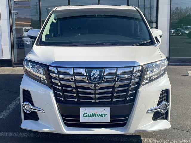 トヨタ アルファードハイブリット SR Cパッケージ 道東・釧路十勝 2015(平27)年 10.8万km ホワイトパールクリスタルシャイン ・サンルーフ/・4WD/・純正9インチSDナビ/(BT フルセグ CD DVD FM AM)/・バックカメラ/・純正11インチフリップダウンモニター/・レーダークルーズコントロール/・両側パワースライドドア/・電動リアゲート/・AC１００V（１５００W）/・前席・2ndパワーシート/・革シート/・電動オットマン/・前席シートヒーター/・ETC2.0/・衝突軽減システム/・横滑り防止/・コーナーセンサー/・前方ドライブレコーダー/・LEDヘッドライト/・フォグライト/・オートマチックハイビーム/・オートライト/・ドアバイザー/・電格ミラー