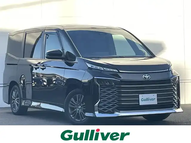 トヨタ ヴォクシー S－G 佐賀県 2024(令6)年 1.8万km アティチュードブラックマイカ 7人乗り/トヨタセーフティセンス/・プリクラッシュセーフティシステム/・レーダークルーズコントロール/・レーンディパーチャーアラート/・オートマチックハイビーム/クリアランスソナー/純正ディスプレイオーディオ/・コネクティッドナビ/・フルセグTV/BT/・CD/DVDデッキ/ETC2.0/純正16インチAW/パワースライドドア/LEDヘッドライト/プッシュスタート/電動パーキングスイッチ/社外前方ドラレコ/取扱説明書/保証書