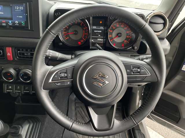 スズキ ジムニー シエラ JC 愛知県 2024(令6)年 2.2万km ミディアムグレー ディスプレイオーディオ　ナビ機能なし/クルーズコントロール/シートヒーター/バックカメラ/Bluetooth/衝突軽減システム/純正アルミホイール/４WD/LEDヘッドライト/レーンキープアシスト/ステアリングスイッチ/スマートキー/プッシュスタート