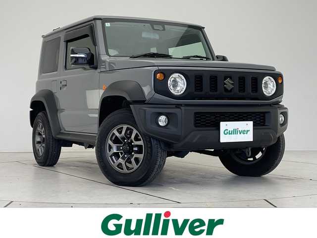 スズキ ジムニー シエラ JC 愛知県 2024(令6)年 2.2万km ミディアムグレー ディスプレイオーディオ　ナビ機能なし/クルーズコントロール/シートヒーター/バックカメラ/Bluetooth/衝突軽減システム/純正アルミホイール/４WD/LEDヘッドライト/レーンキープアシスト/ステアリングスイッチ/スマートキー/プッシュスタート