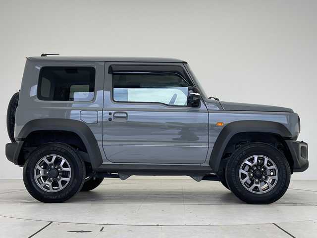 スズキ ジムニー シエラ JC 愛知県 2024(令6)年 2.2万km ミディアムグレー ディスプレイオーディオ　ナビ機能なし/クルーズコントロール/シートヒーター/バックカメラ/Bluetooth/衝突軽減システム/純正アルミホイール/４WD/LEDヘッドライト/レーンキープアシスト/ステアリングスイッチ/スマートキー/プッシュスタート