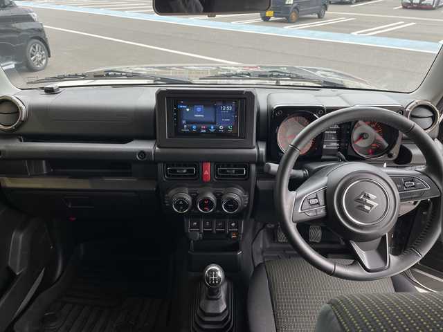 スズキ ジムニー シエラ JC 愛知県 2024(令6)年 2.2万km ミディアムグレー ディスプレイオーディオ　ナビ機能なし/クルーズコントロール/シートヒーター/バックカメラ/Bluetooth/衝突軽減システム/純正アルミホイール/４WD/LEDヘッドライト/レーンキープアシスト/ステアリングスイッチ/スマートキー/プッシュスタート