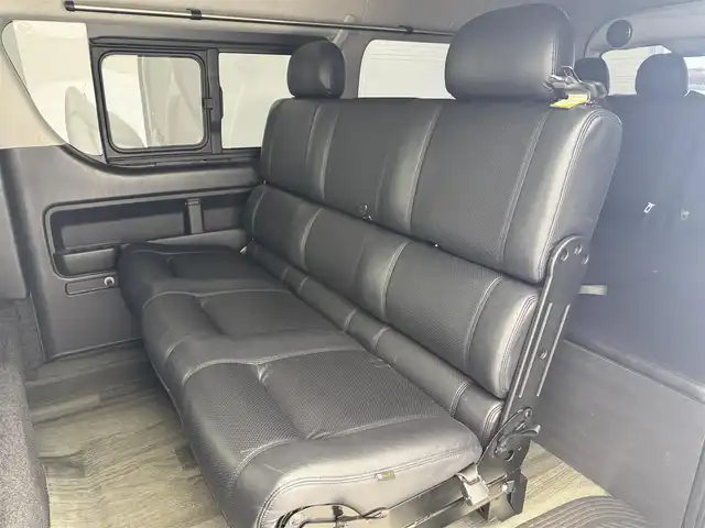 トヨタ ハイエース GL 愛知県 2016(平28)年 9.3万km ホワイトパールクリスタルシャイン 伊原工業アイシート（ベッドキット）/フロントスポイラー/リアスポイラー/リアウィング/SDナビ（AVIC-ZH0777W）/・CD/・DVD/・Bluetooth/フリップダウンモニター/パワースライドドア/レザー調シートカバー/ダズフェローズテールランプ/LEDヘッドライト/ツイーター/電動格納ミラー/プッシュスタート/ETC/フォグランプ/ミラー型レーダー探知機/フローリングマット